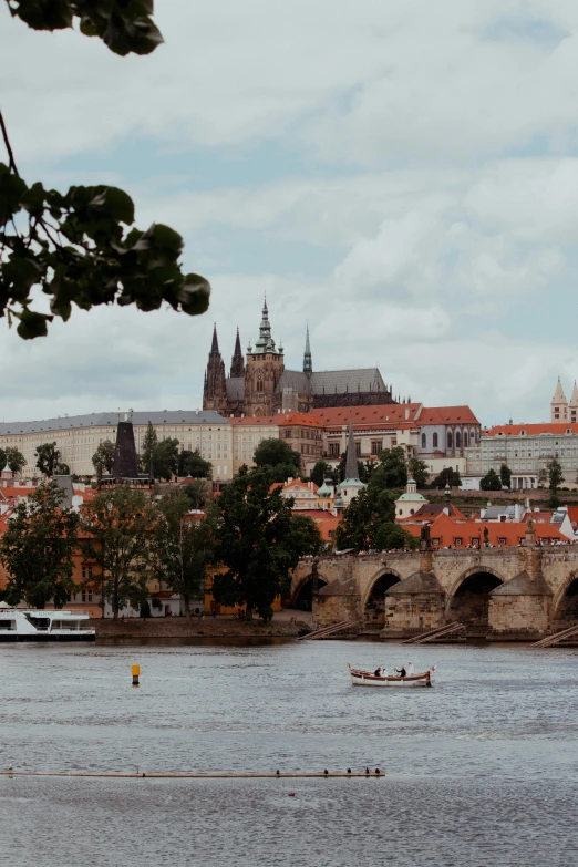 a view of some old buildings and boats on the water