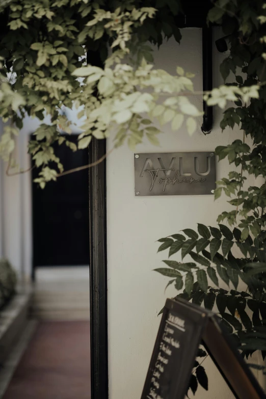 a home sign above the door of the house