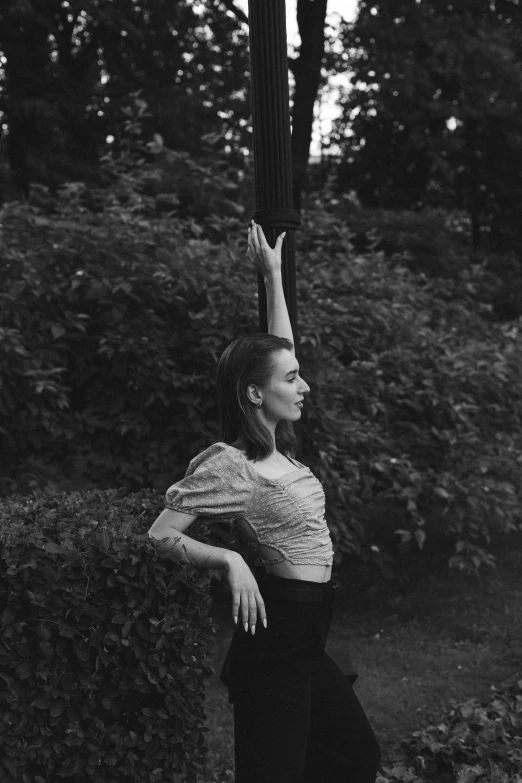 a black and white po of a woman stretching