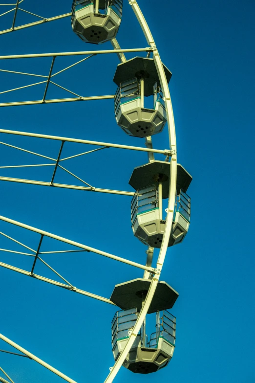 the ferris wheel against a bright blue sky