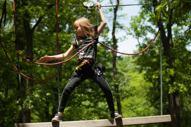 a  on ropes jumping high in the air