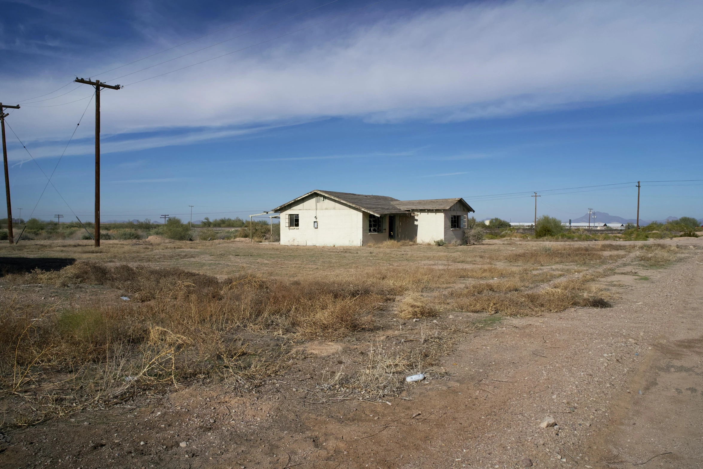 a house that is sitting out in the field