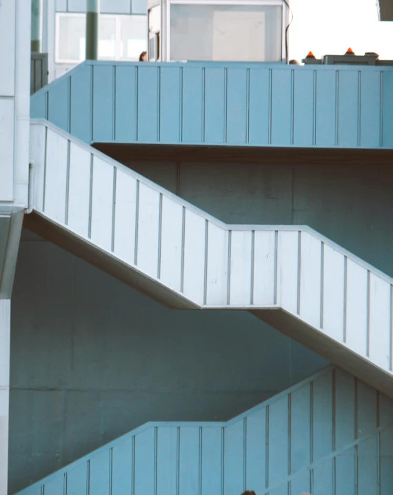 a man is standing next to stairs outside