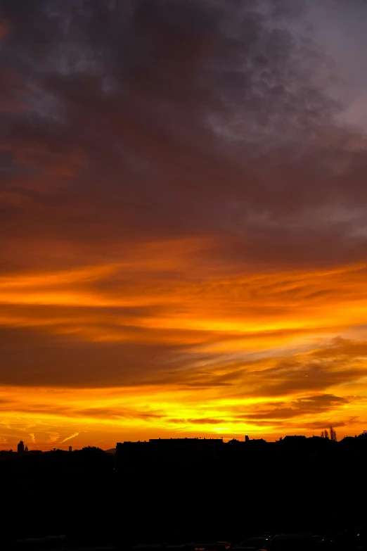 a very beautiful sunset with clouds above it