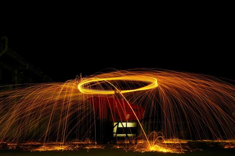 sparks streaking through the air near a chair