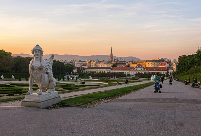 a group of people standing in front of a statue