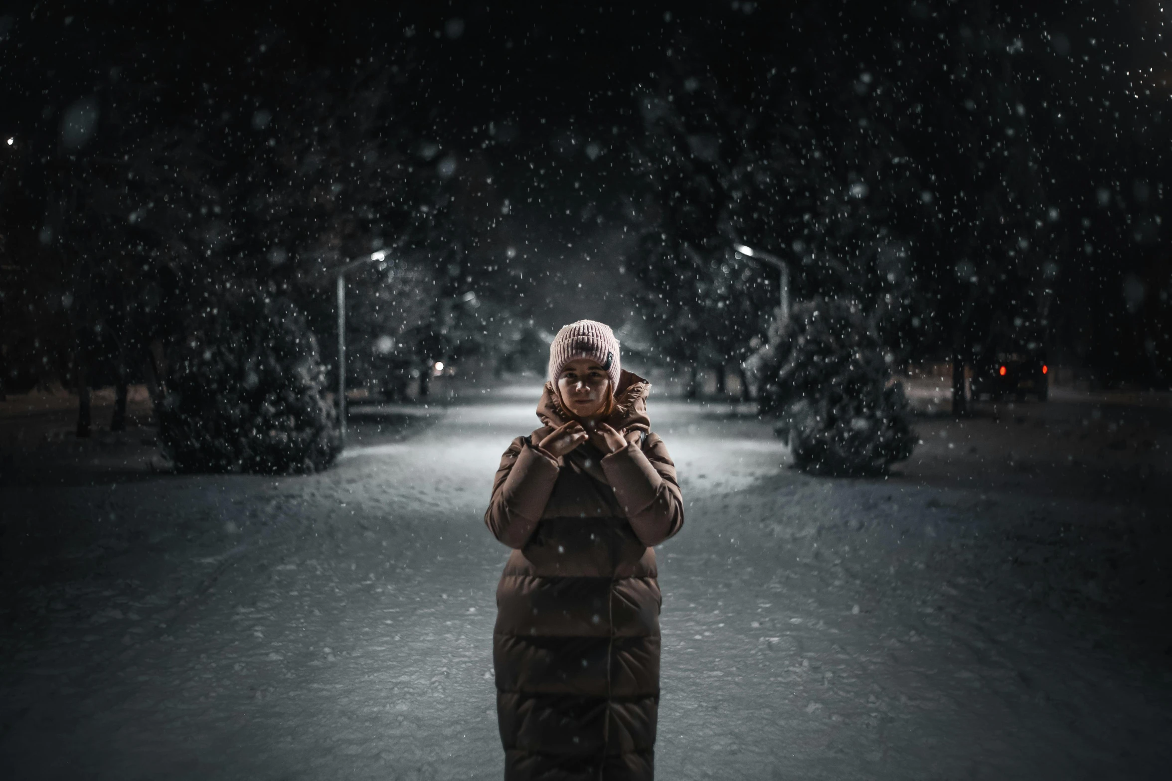 person walking on a snowy street while covered in snow