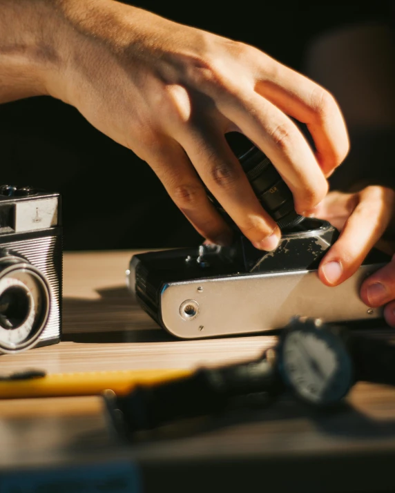 a person putting some soing in a camera