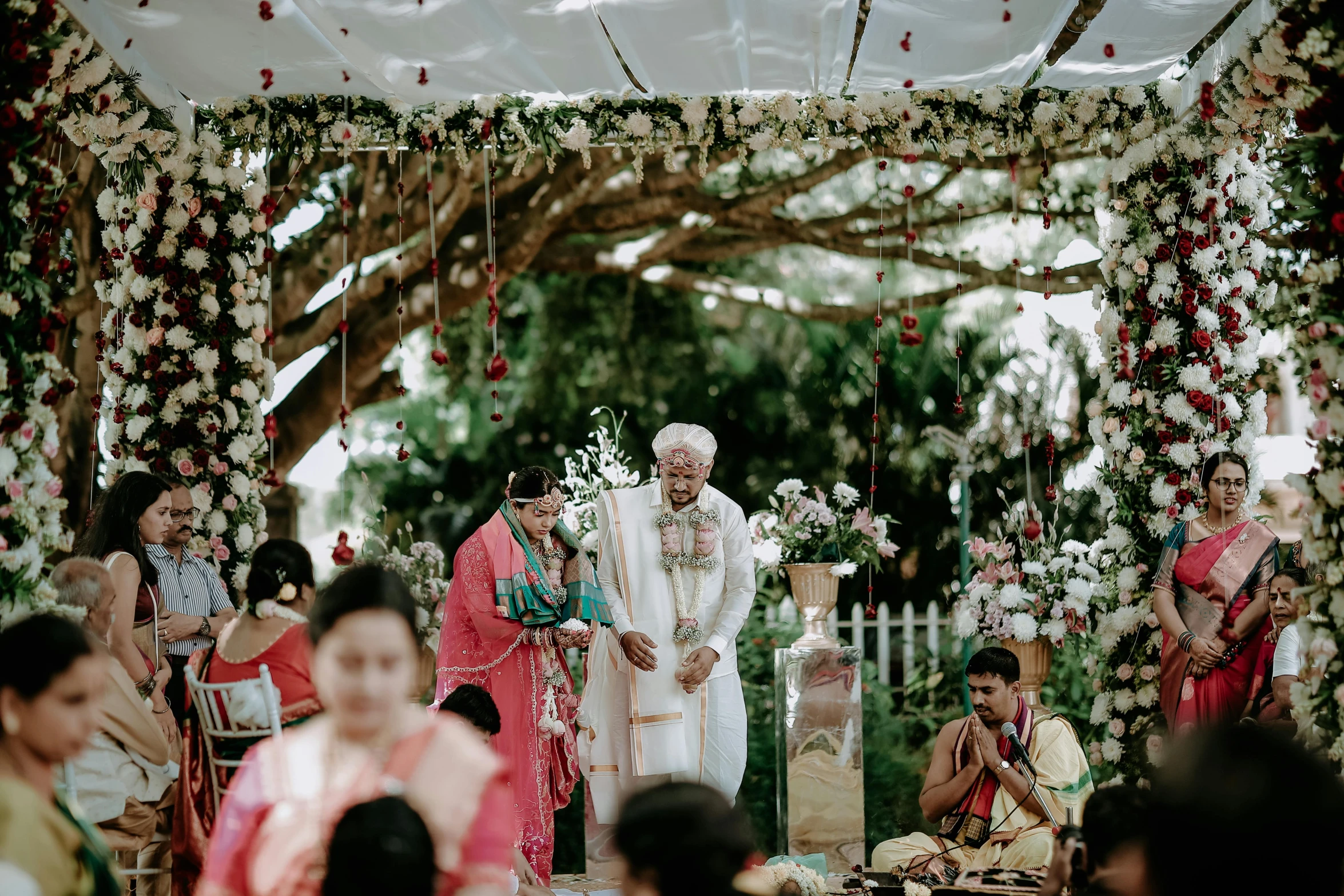 a man and woman walk down the aisle