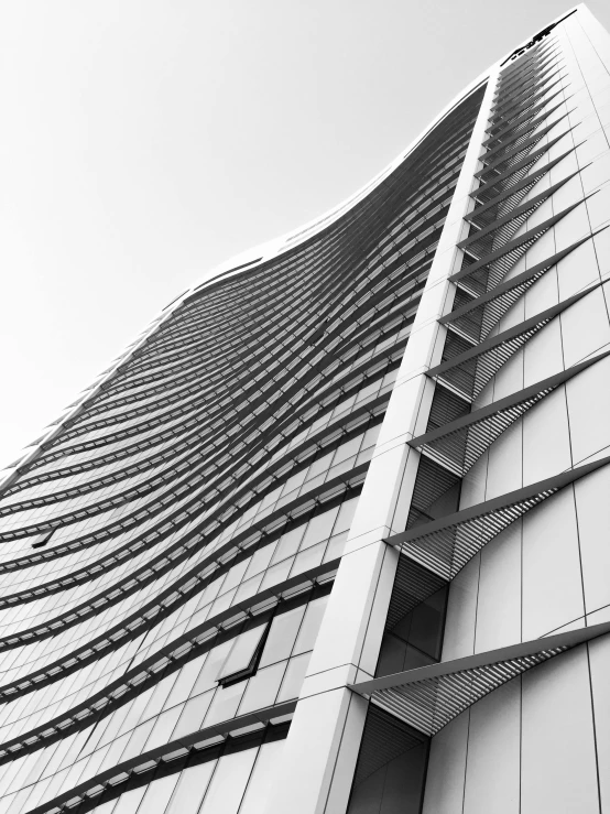 the top of an office building against a cloudy sky