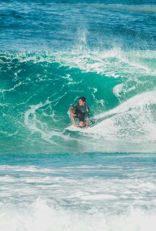 the person rides a surfboard on a wave