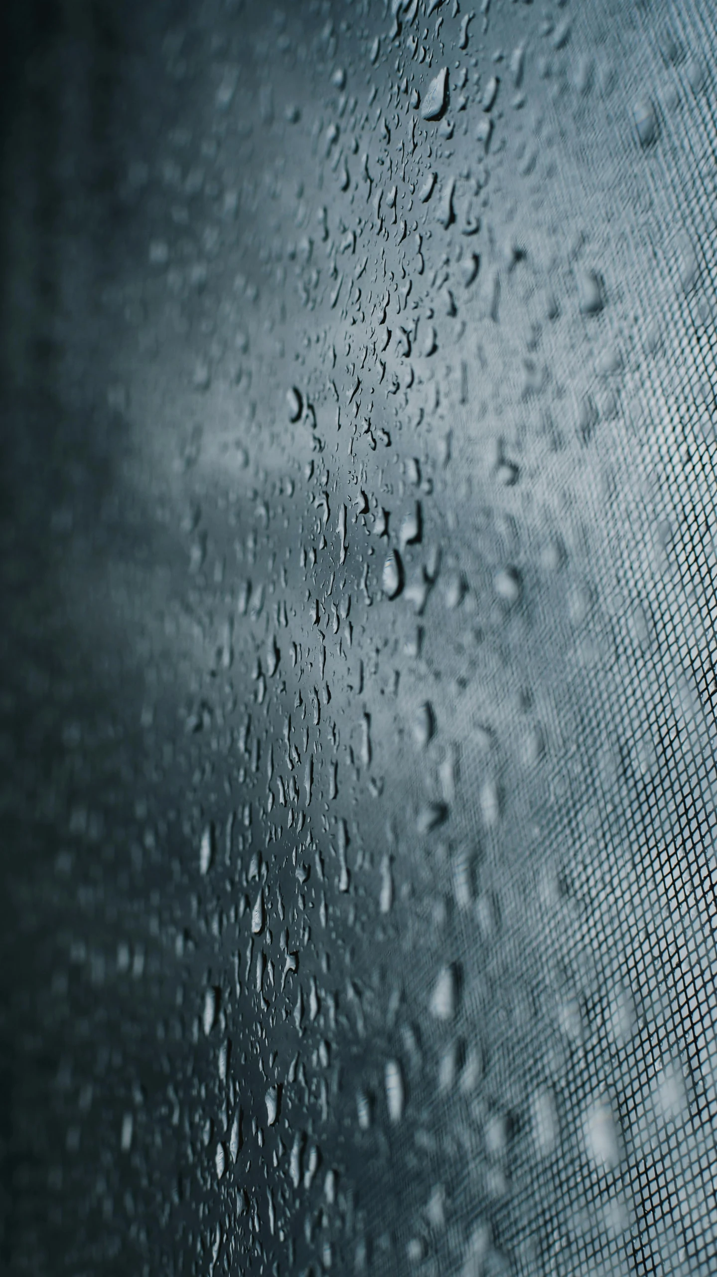 the back and side of a window with water drops on it