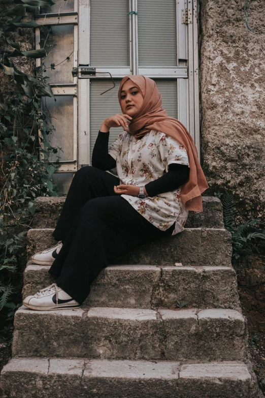 an image of a woman sitting on some steps