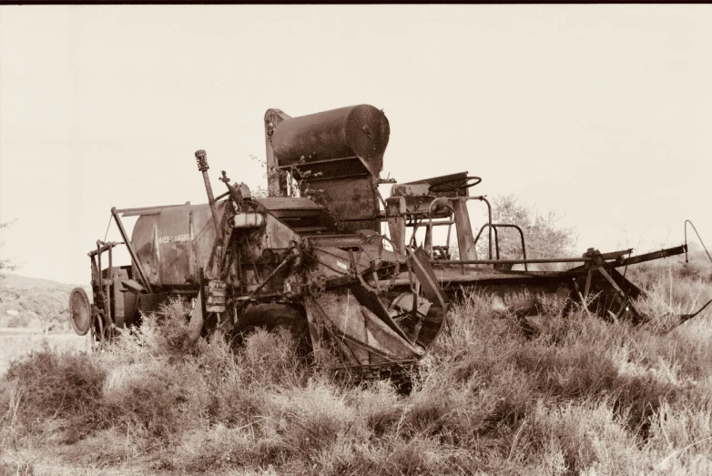 a large truck is parked in the middle of some brush