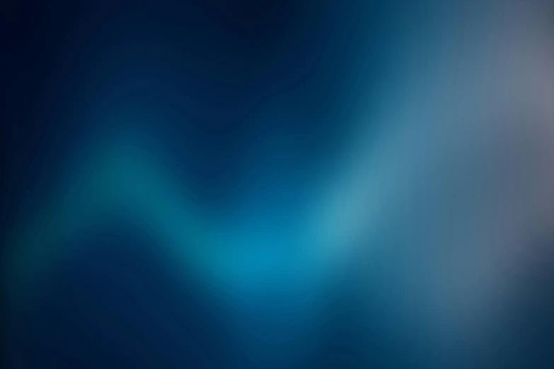 an abstract, blue - toned background with bluring lights