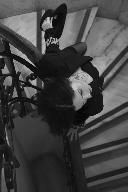 an overexposed picture of a young woman climbing up a set of stairs