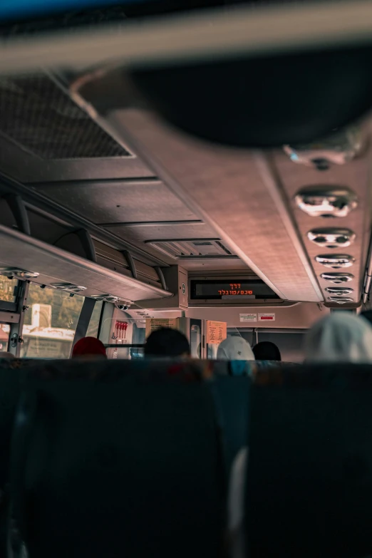 a bus filled with passengers and looking into the distance