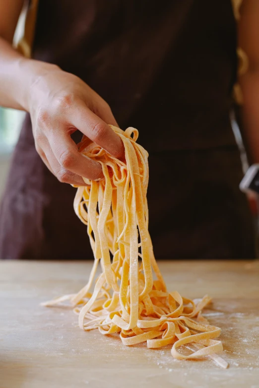 a person preparing to make a pasta sauce