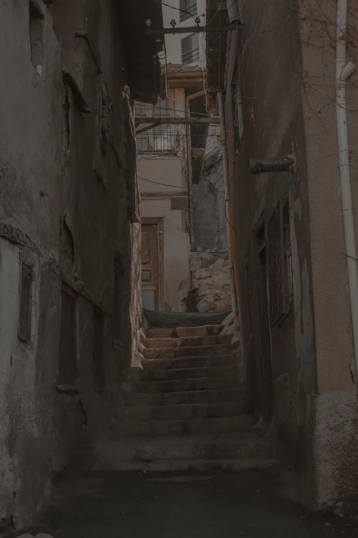 a staircase leads down to some very old buildings