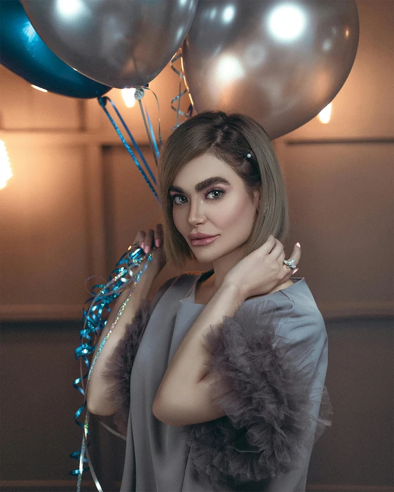 a woman with her hands on her back while holding balloons