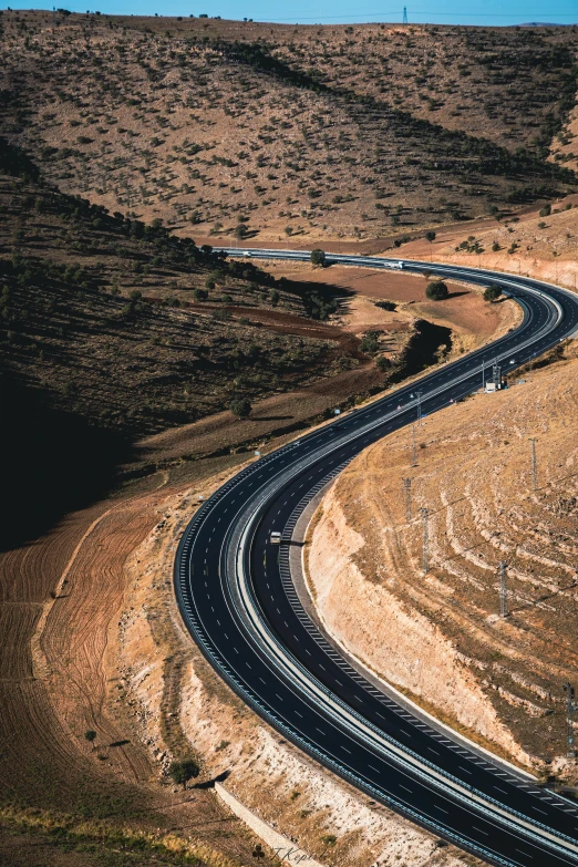 a road winding up from the side into the distance