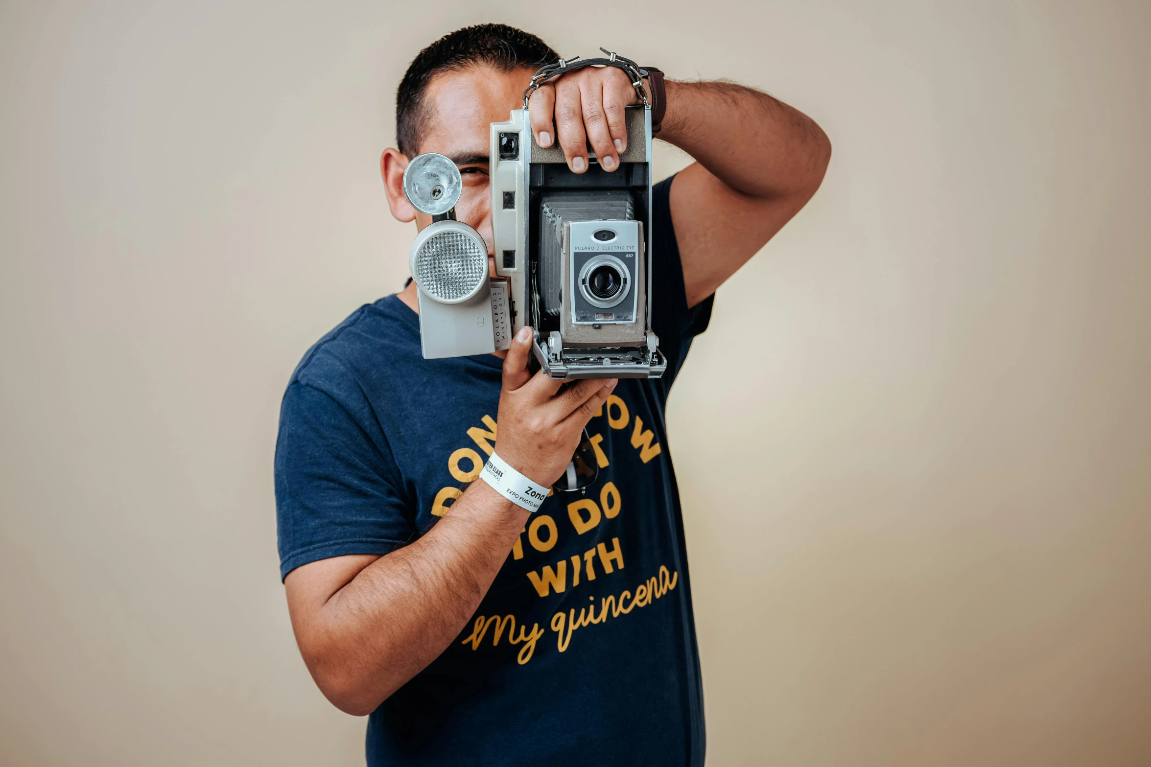 a man looking through the lens of an old camera