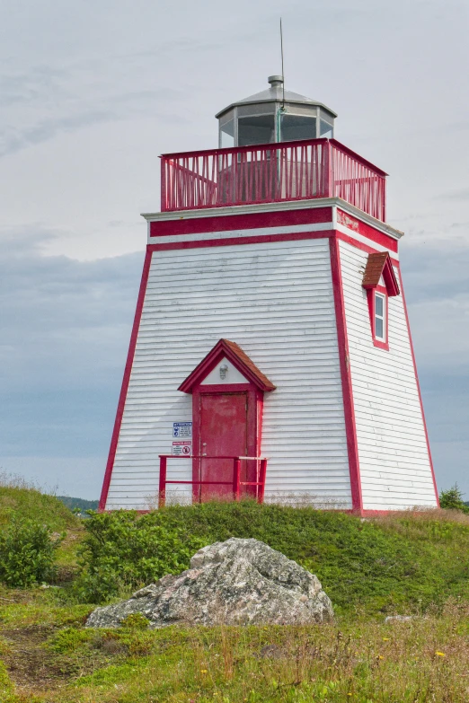 a red and white building on top of a hill