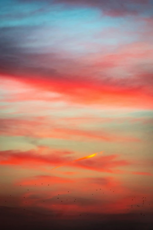 a red, yellow and blue sunset in a sky