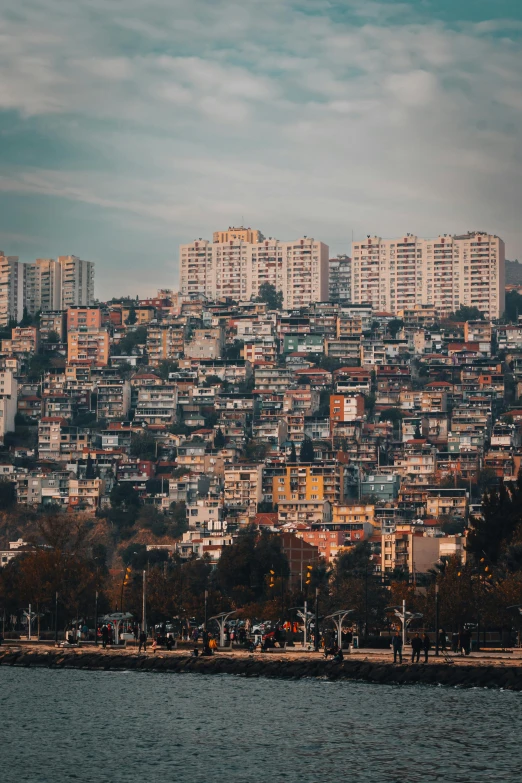 a large hill of buildings behind a city