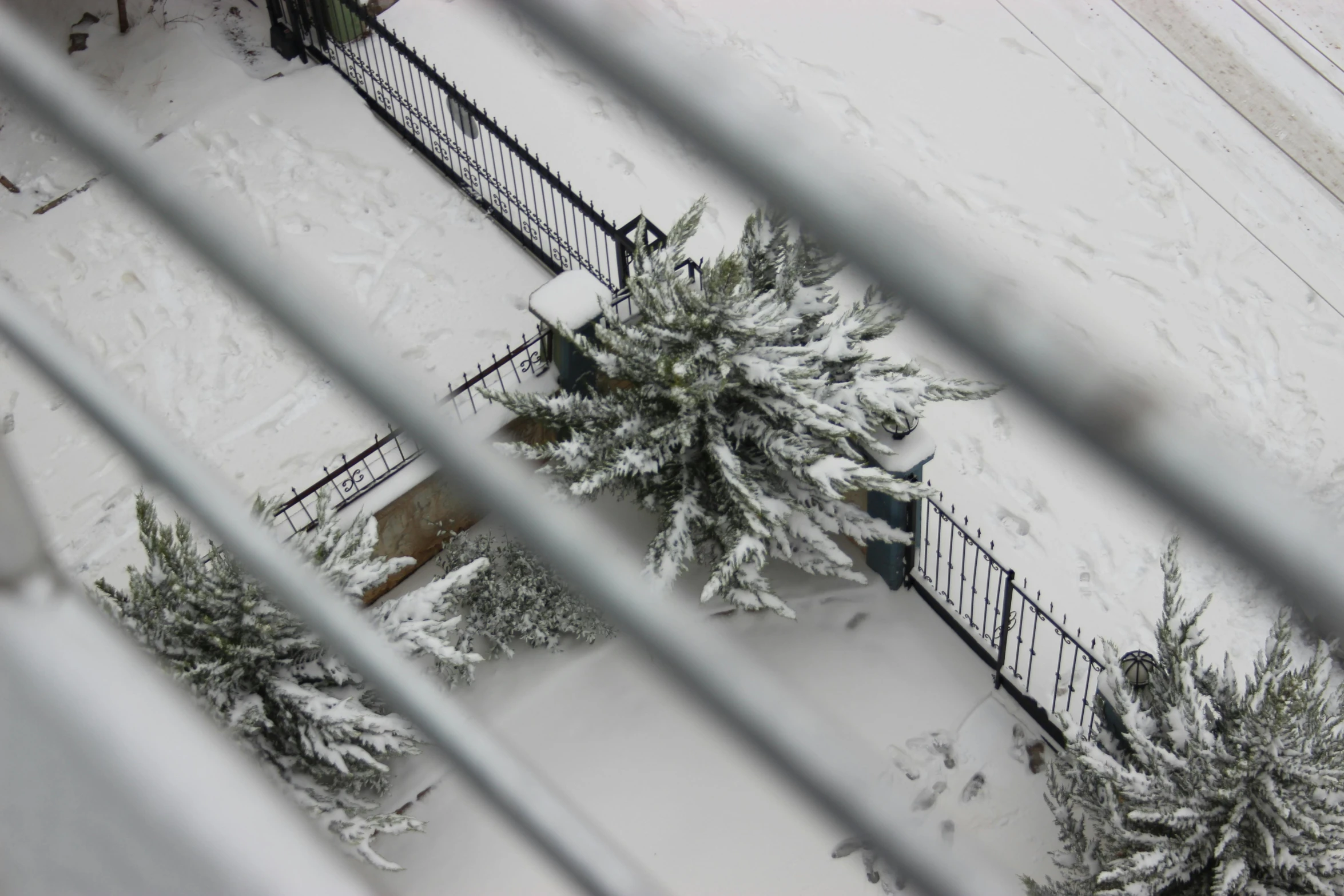 snow is on the ground outside the front of a house