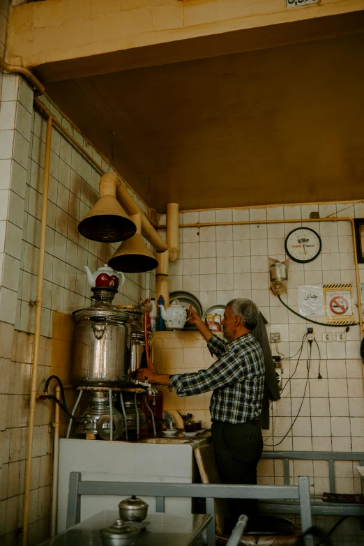 the cook works on preparing meals in the kitchen