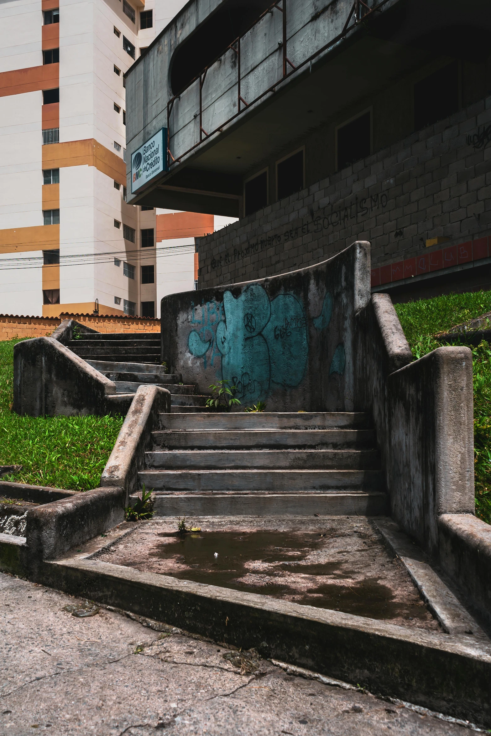 a bunch of steps outside some buildings with graffiti on them