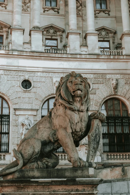 statue of a lion in front of a building