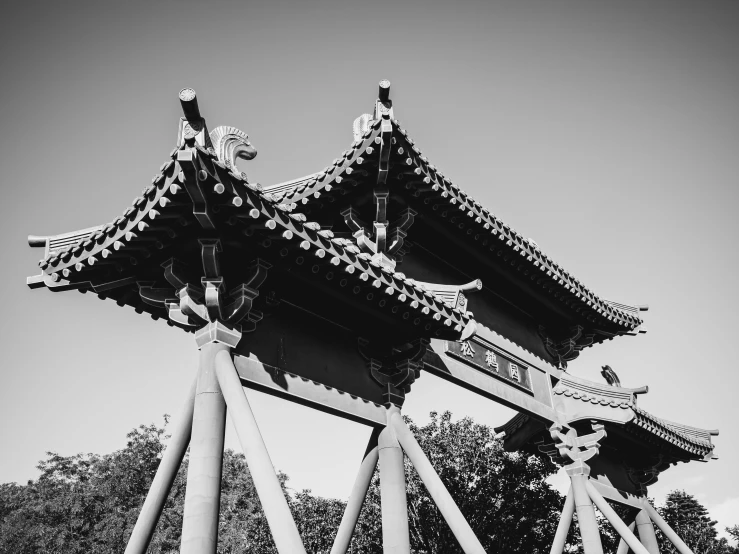 a large tall building with some statues on top