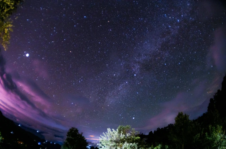 a night sky with stars and bright lights