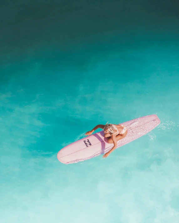 a woman on a surf board in the ocean