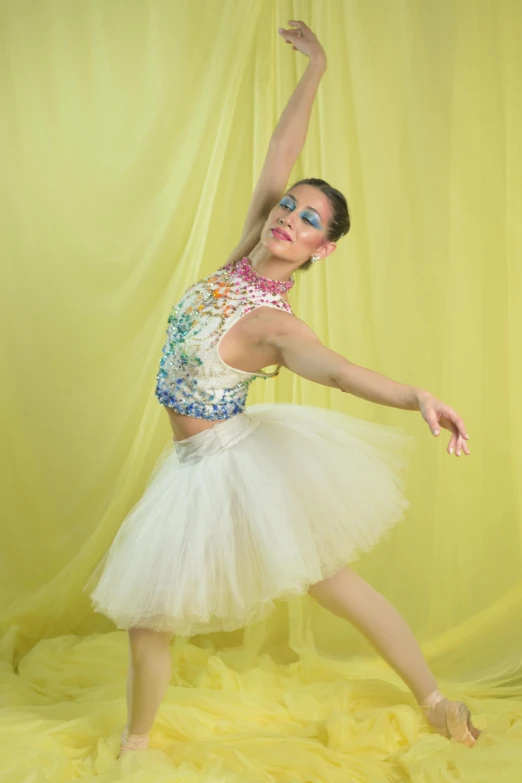 a beautiful young lady standing on her legs with a dance pose