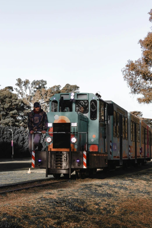 a train is carrying a person on a platform