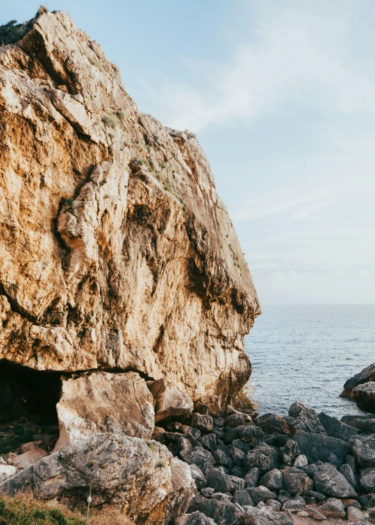 large rock outcropping on the edge of the ocean