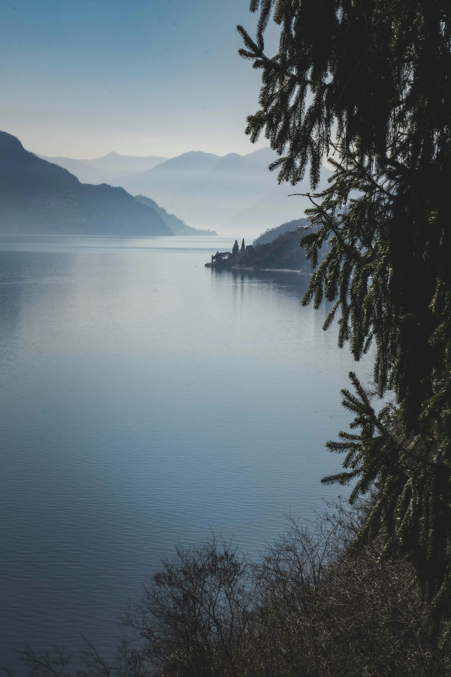 a small boat floating on top of a large body of water