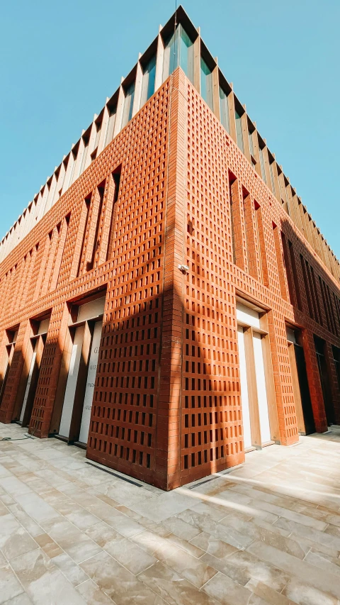 a building made of red bricks and concrete