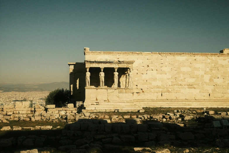 a couple of people riding bikes in front of a stone building