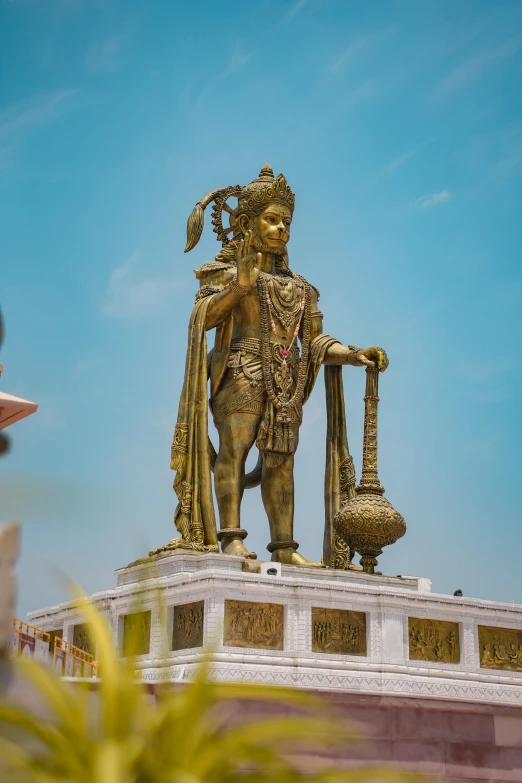 the statue is standing in a corner on a small platform