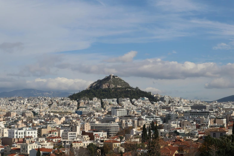 view of city and hill from top of building