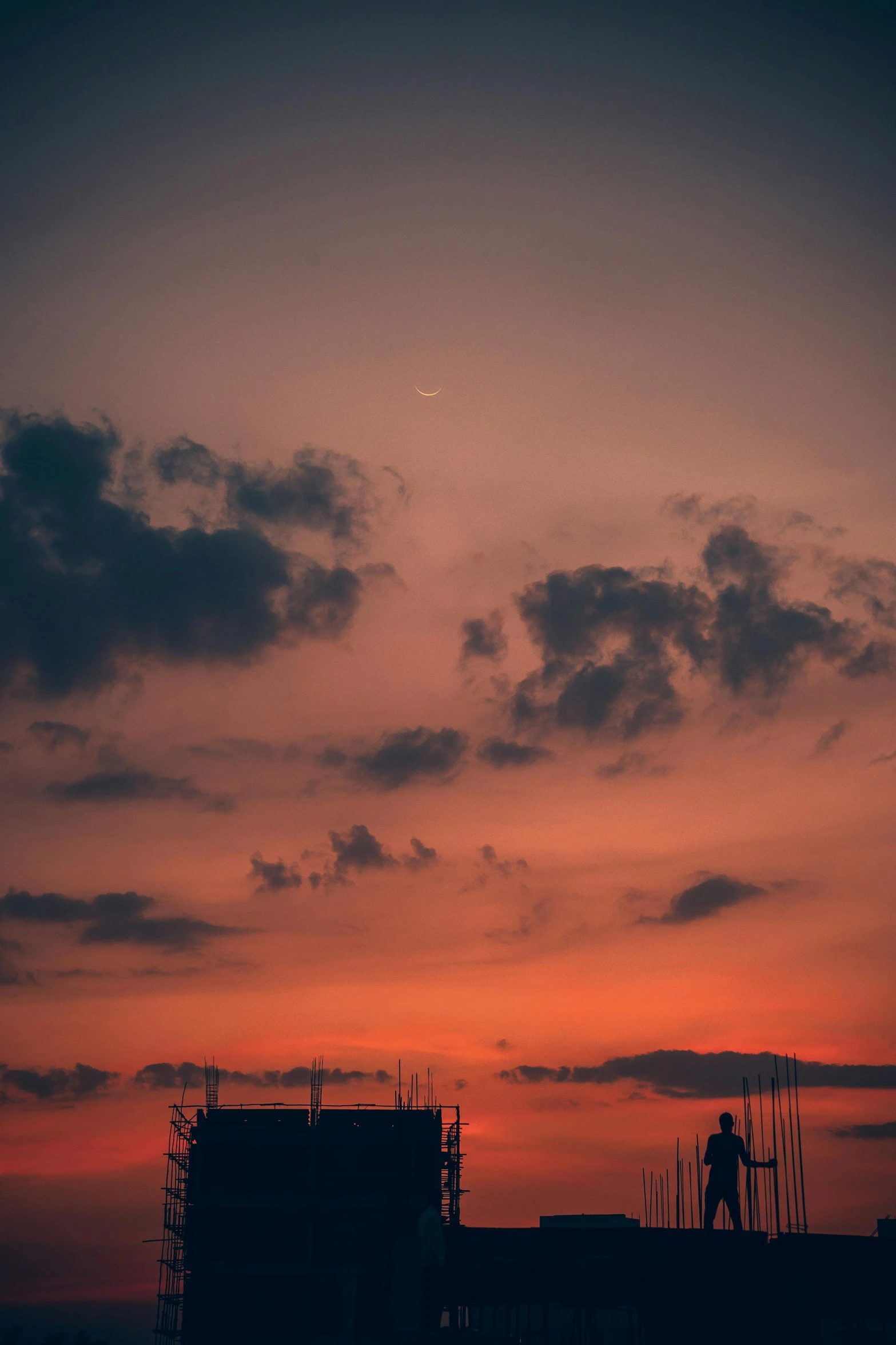 an airplane taking off from a runway at sunset