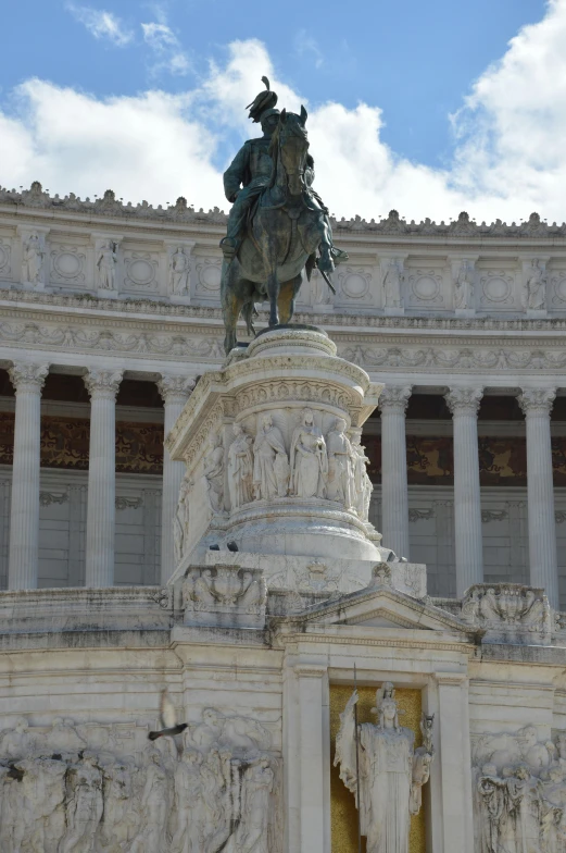 a statue sits on top of the monument