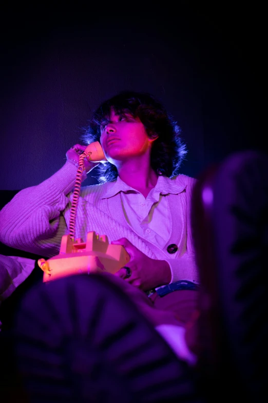 a woman talking on the phone with her hand over her mouth