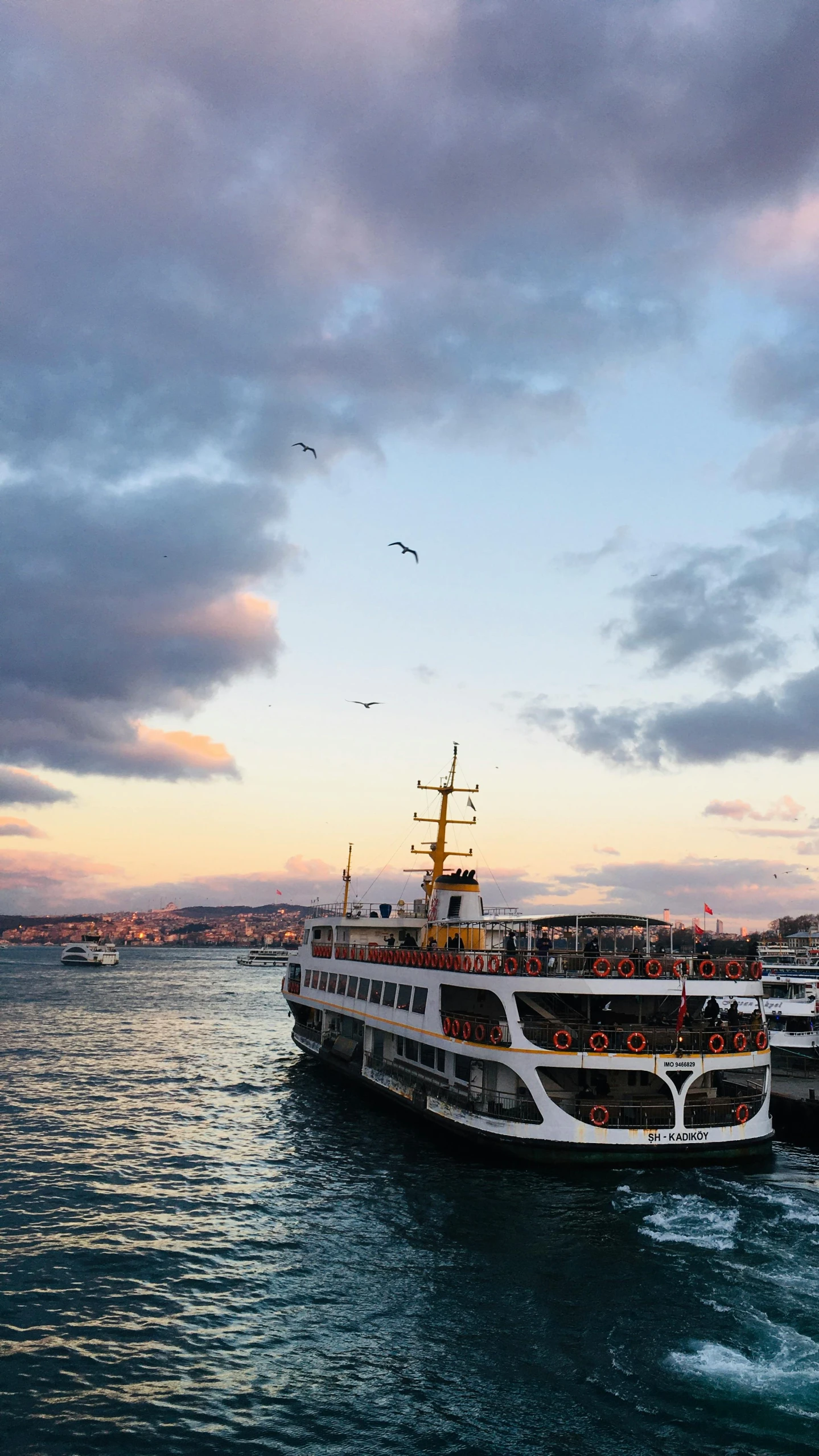 the boats are out in the water during a sunset