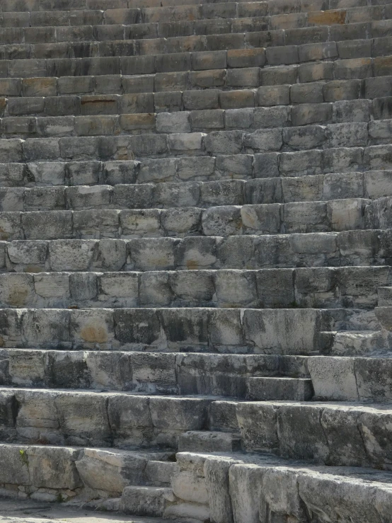 a man sitting on a stair case looking down