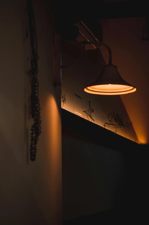 a lamp hanging in a dimly lit room